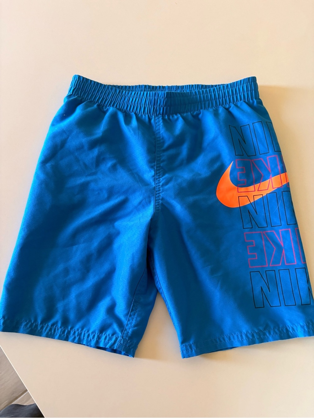 Nike Boys' Blue Athletic Shorts with Orange Swoosh